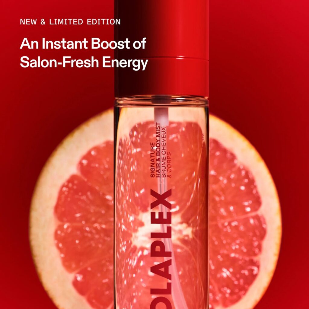 Olaplex Signature Hair & Body Mist limited-edition bottle over grapefruit